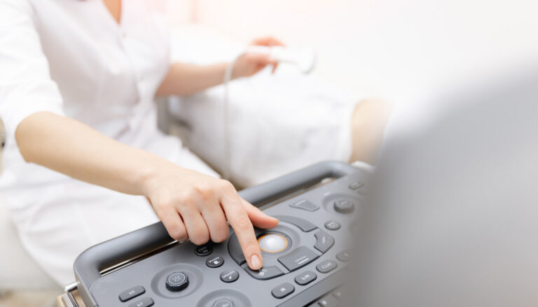 Female technician using a ultrasound scanner